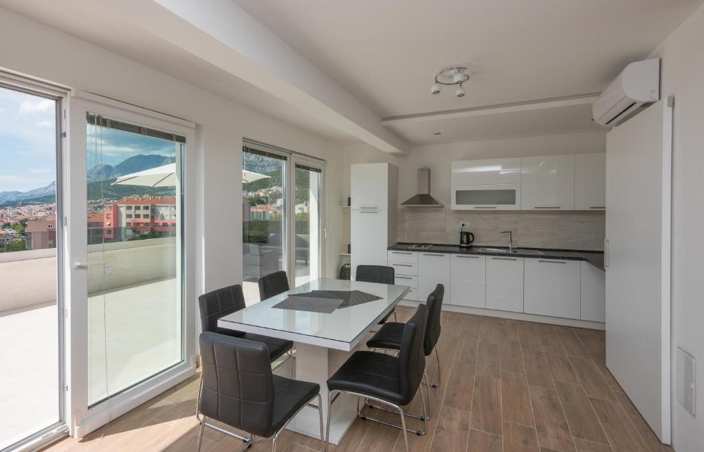 Kuchyň nebo kuchyňský kout v ubytování Apartments Villa Hadria