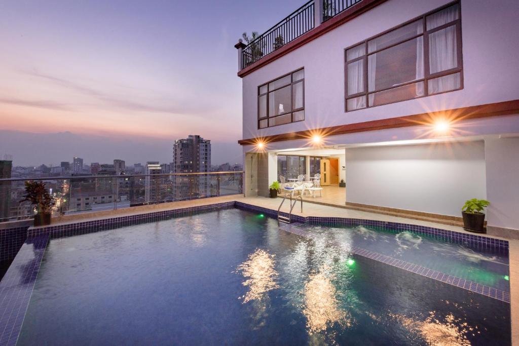 a swimming pool on the roof of a building at SOHO Residence in Phnom Penh