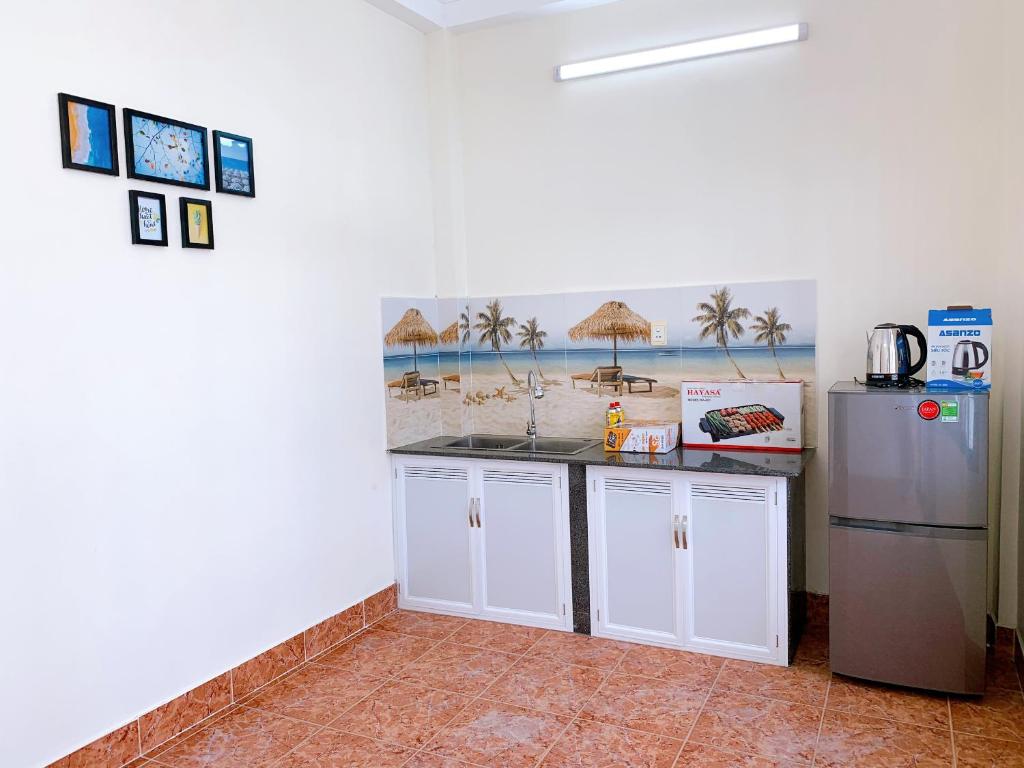 Kuchyň nebo kuchyňský kout v ubytování Xoài Xanh Hostel & Villa