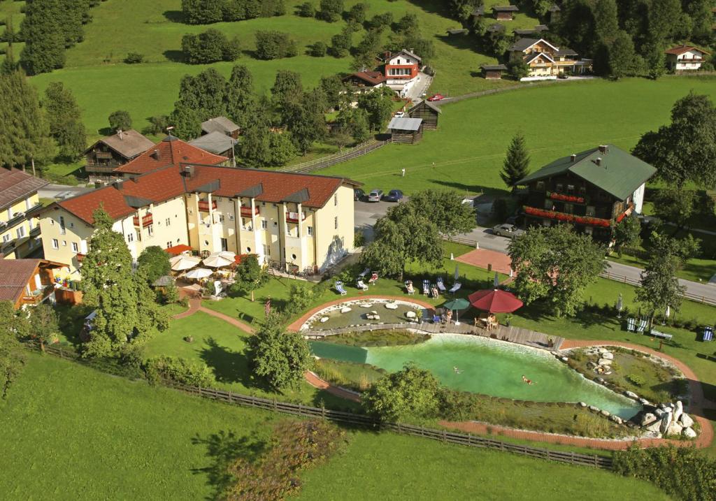 an aerial view of a resort with a swimming pool at Landhotel Lerch Plankenau in Sankt Johann im Pongau