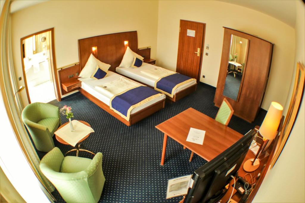 Postel nebo postele na pokoji v ubytování Victoria Hotel