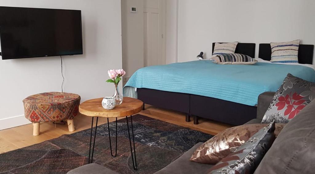 Postel nebo postele na pokoji v ubytování Barbera Apartments Haarlem