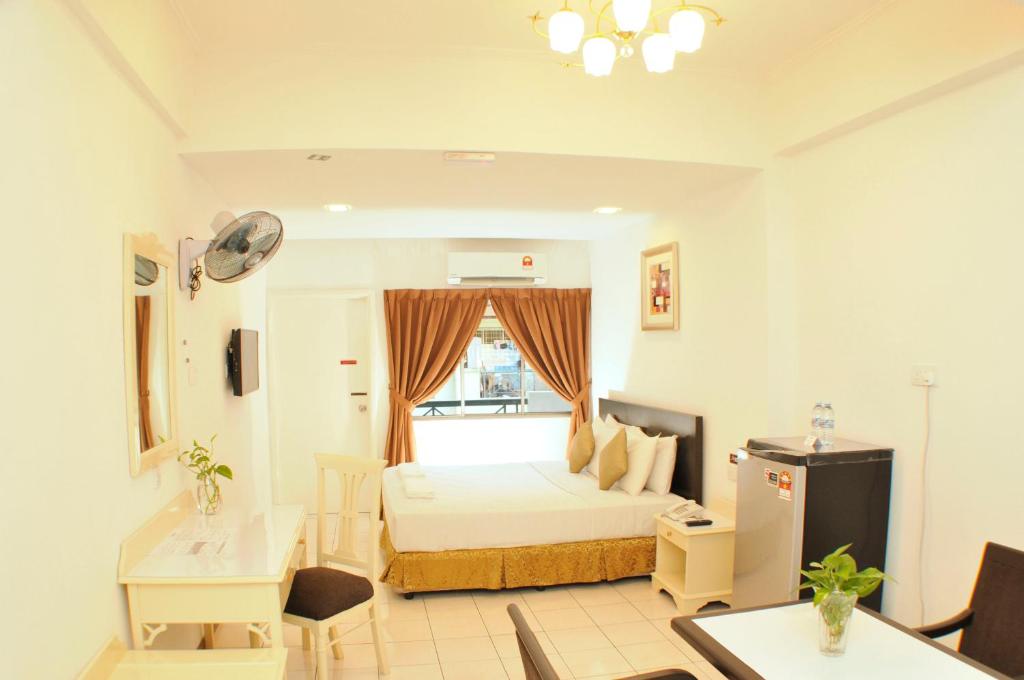 Postel nebo postele na pokoji v ubytování Promenade Service Apartment