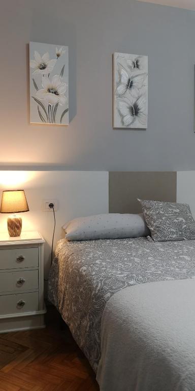 A bed or beds in a room at Piso Camino de Santiago 2