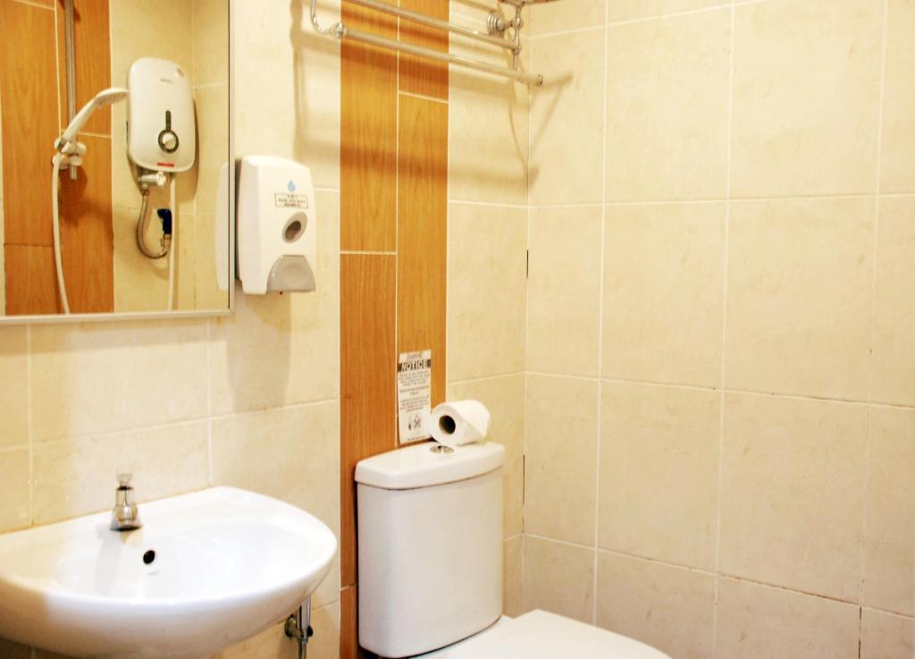 Koupelna v ubytování Promenade Service Apartment