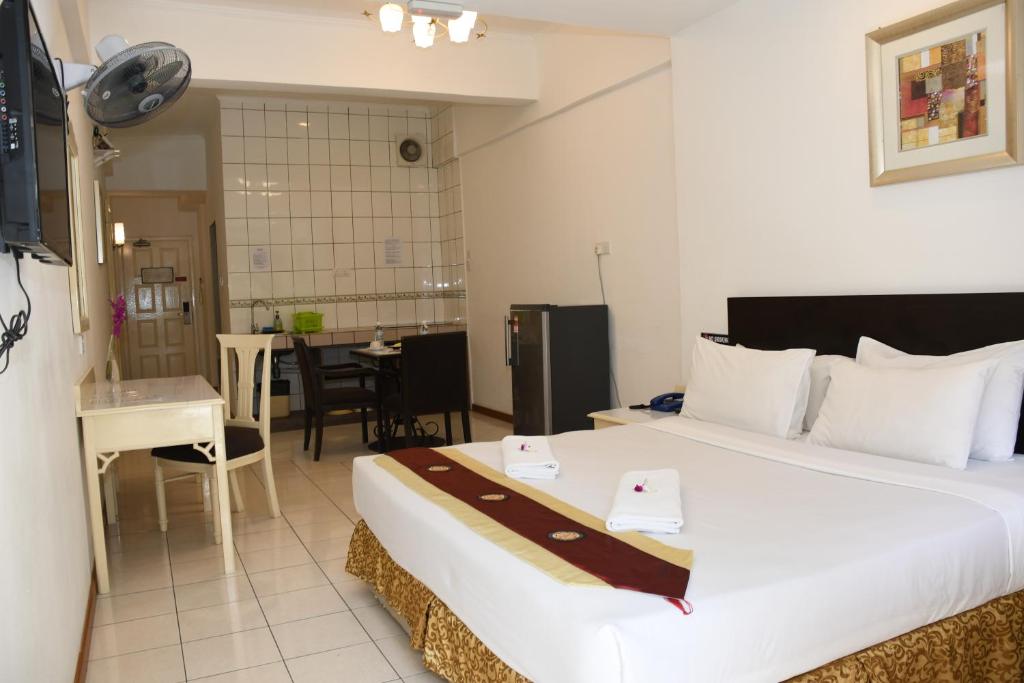Postel nebo postele na pokoji v ubytování Promenade Service Apartment
