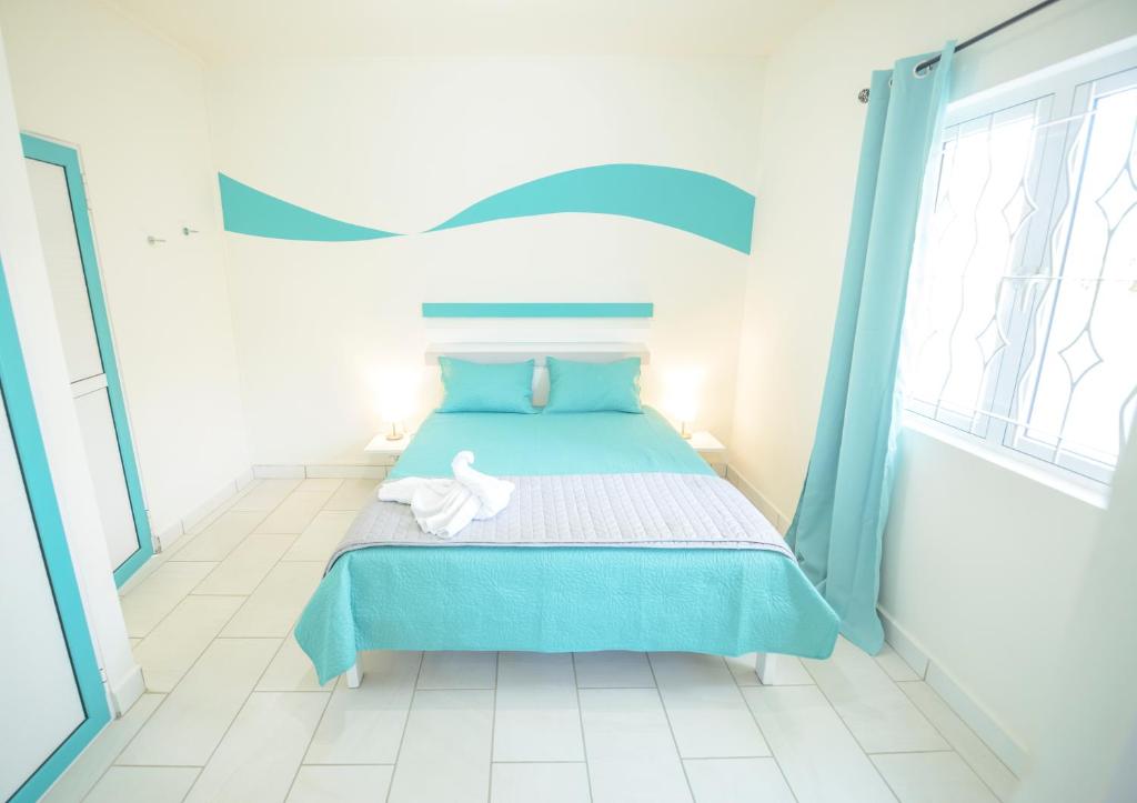 Postel nebo postele na pokoji v ubytování Abiki Mauritius