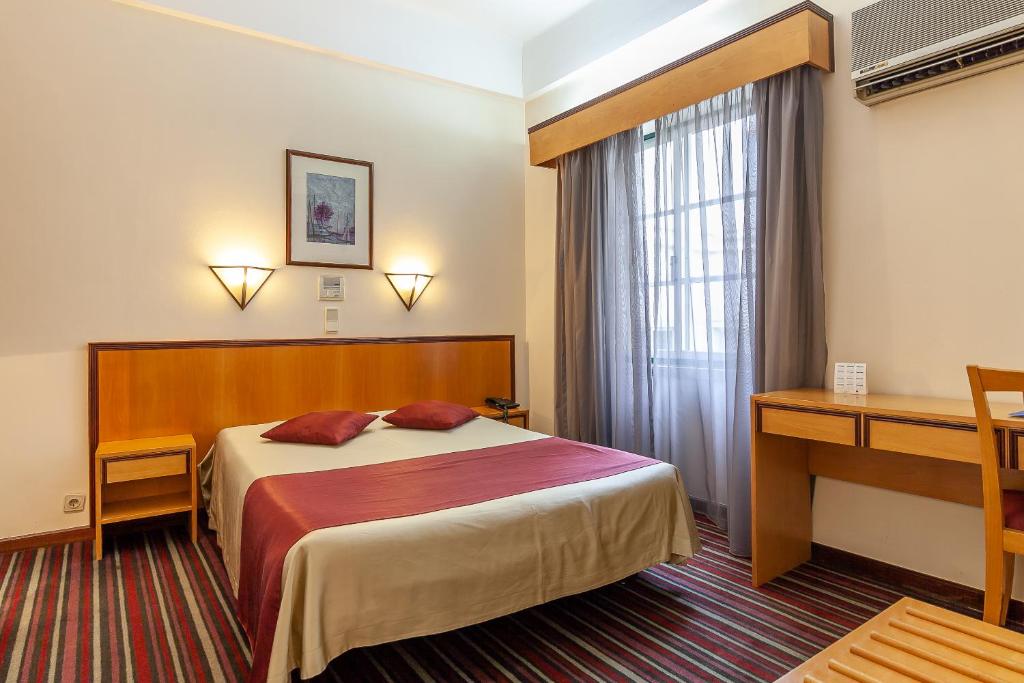Postel nebo postele na pokoji v ubytování Residencial Horizonte