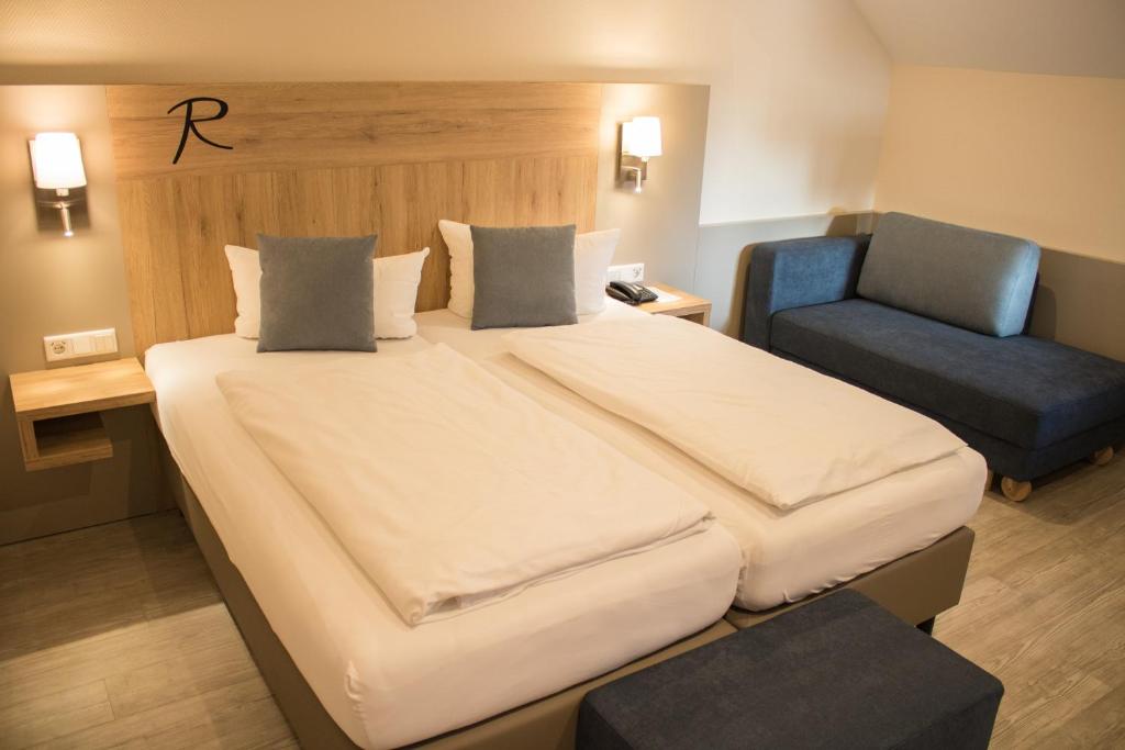 Postel nebo postele na pokoji v ubytování Hotel Rosenbusch