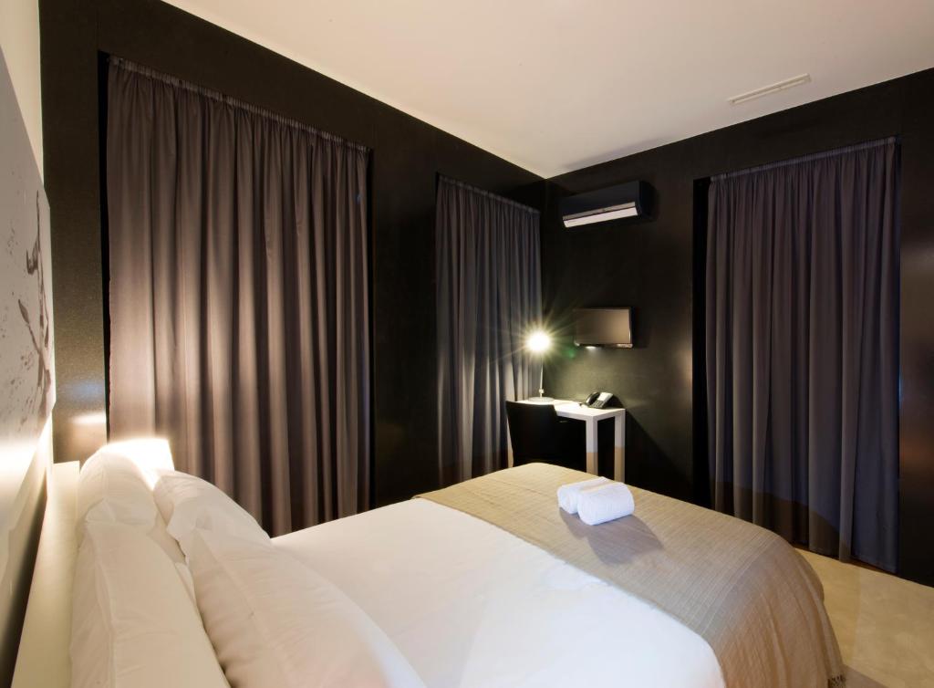 Postel nebo postele na pokoji v ubytování Arc My Otel
