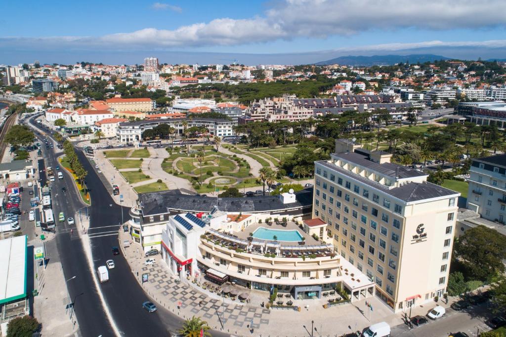 an aerial view of a city with a building at Vila Galé Estoril in Estoril
