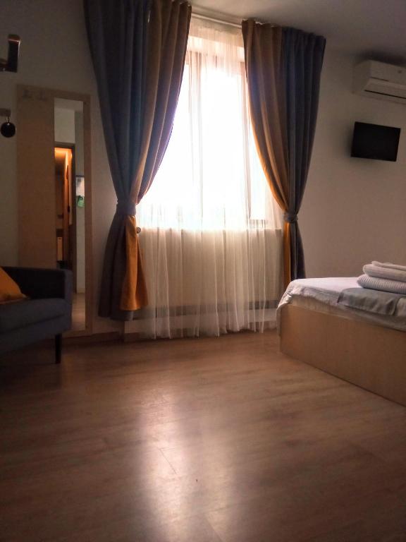 Postel nebo postele na pokoji v ubytování Central Guesthouse