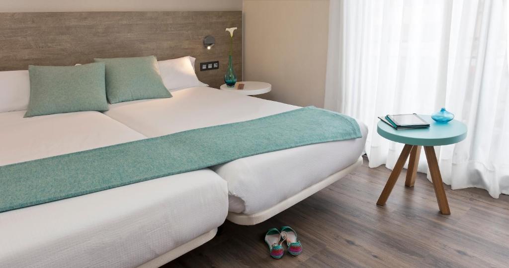 Postel nebo postele na pokoji v ubytování Hotel Dos Rios Central