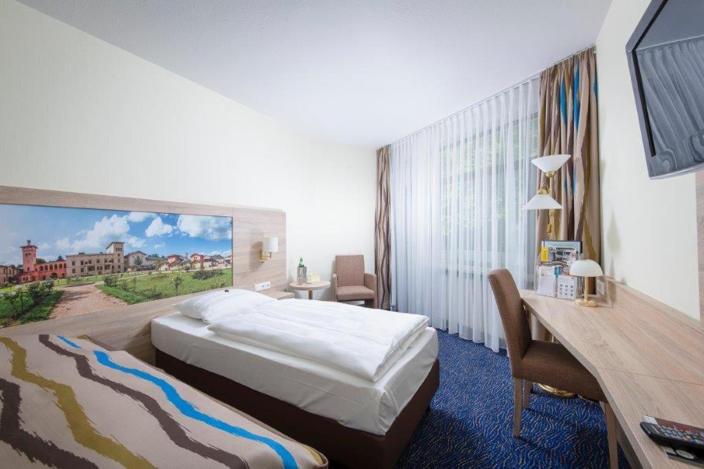 Postel nebo postele na pokoji v ubytování Seehotel Grunewald