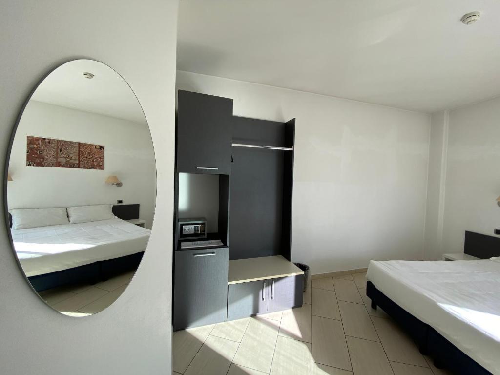 Postel nebo postele na pokoji v ubytování Hotel La Locanda
