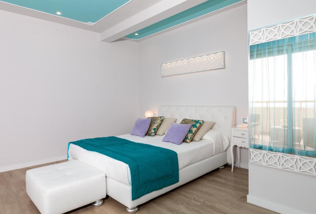 Postel nebo postele na pokoji v ubytování Hotel Carlton