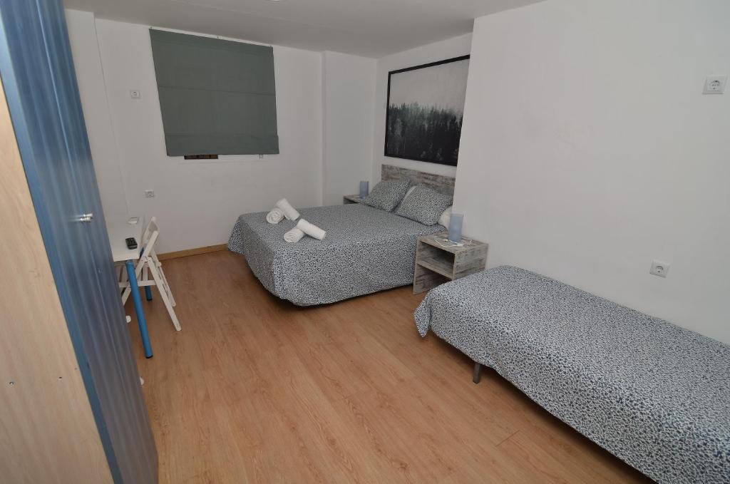 Posteľ alebo postele v izbe v ubytovaní Hotel Boutique Nomadas