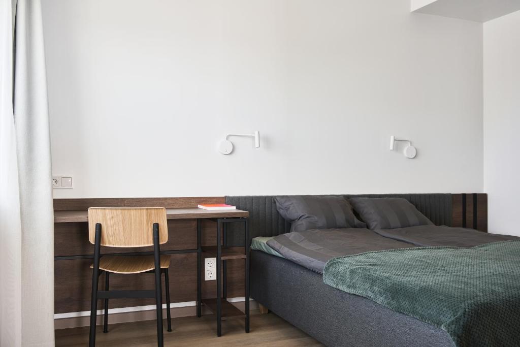 Postel nebo postele na pokoji v ubytování LURICH Residences