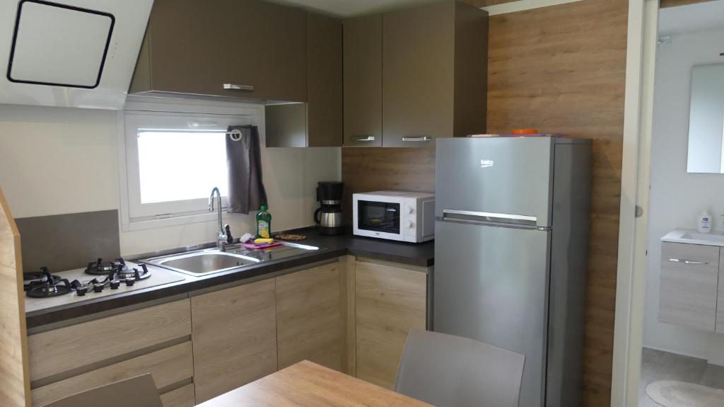 Kuchyň nebo kuchyňský kout v ubytování Agricampeggio Relax Maxicaravan