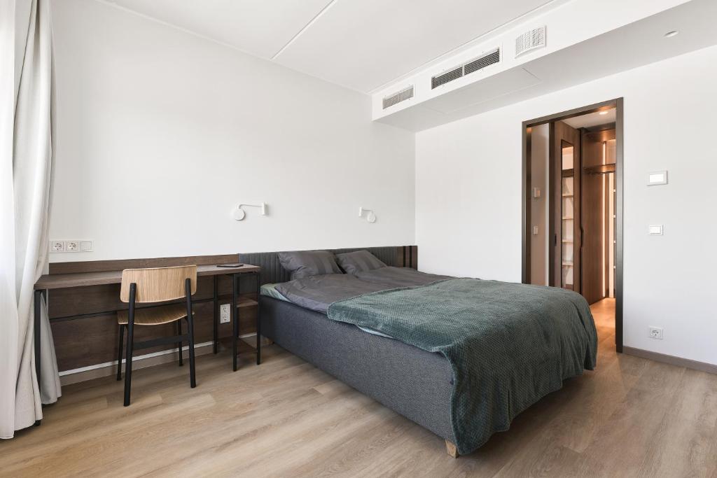 Postel nebo postele na pokoji v ubytování LURICH Residences
