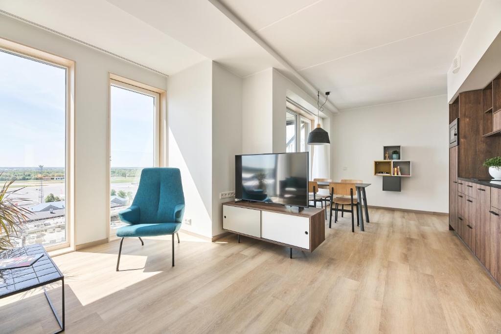 TV a/nebo společenská místnost v ubytování LURICH Residences