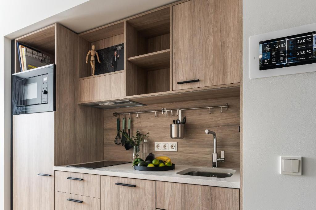 Kuchyň nebo kuchyňský kout v ubytování LURICH Residences