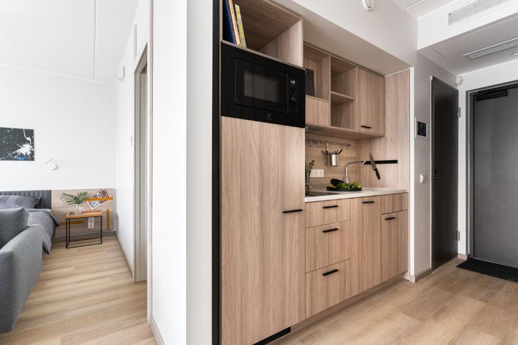 Kuchyň nebo kuchyňský kout v ubytování LURICH Residences