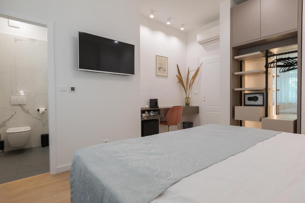 Postel nebo postele na pokoji v ubytování Green Park Luxury Rooms