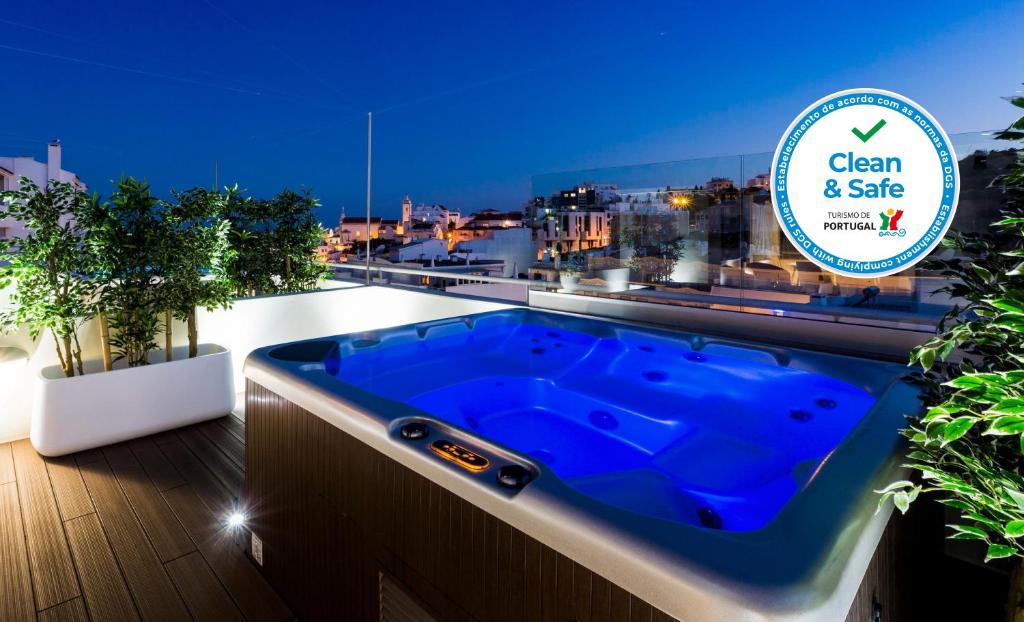 a hot tub on the roof of a building at D_Loft Downtown in Albufeira