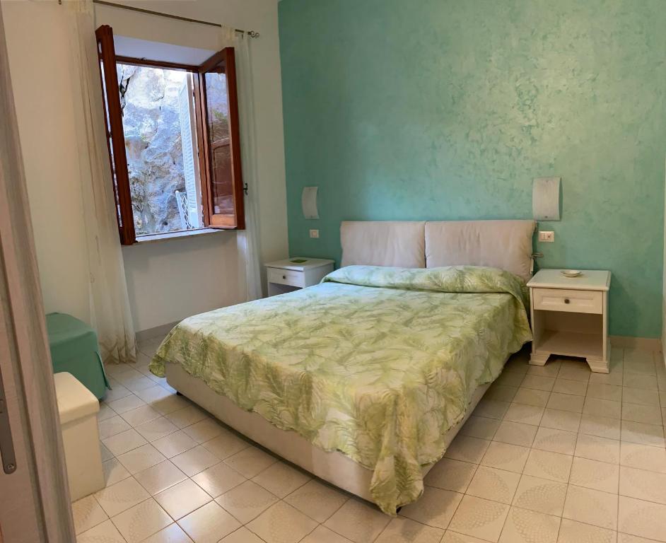 Cama ou camas em um quarto em Acquamarina Accommodation