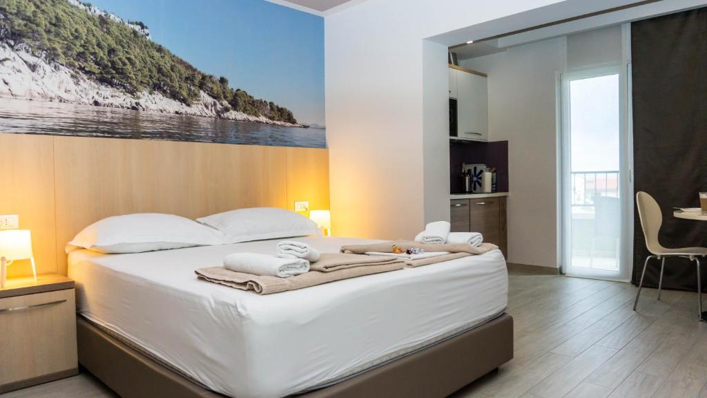 Postel nebo postele na pokoji v ubytování Apartments Hermes