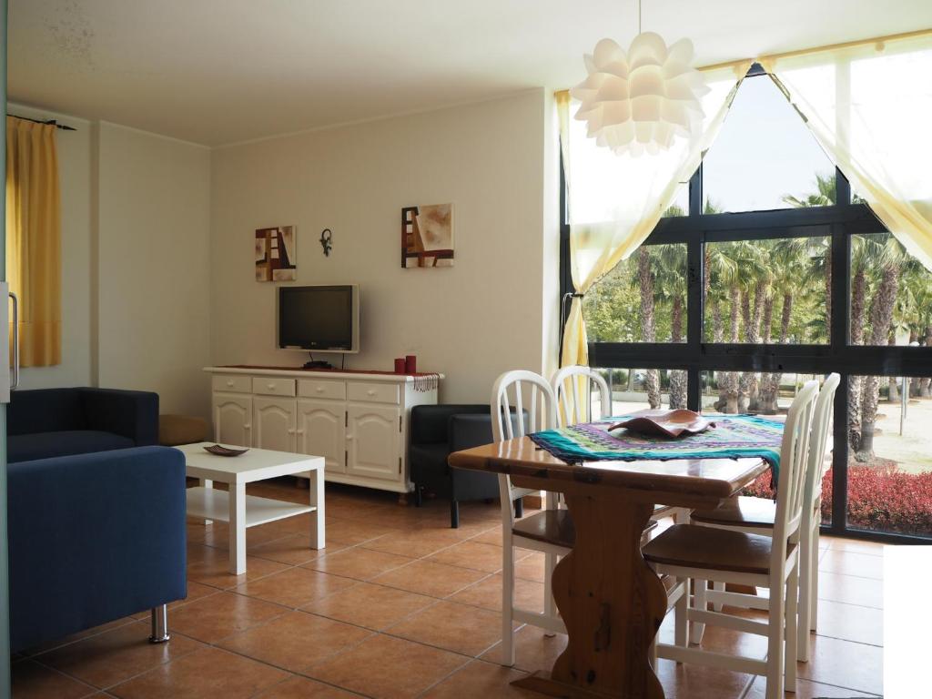 TV a/nebo společenská místnost v ubytování NINFA Apartamento con balcón ideal familias con vistas al mar