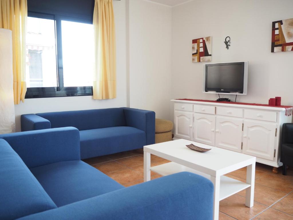 TV a/nebo společenská místnost v ubytování NINFA Apartamento con balcón ideal familias con vistas al mar