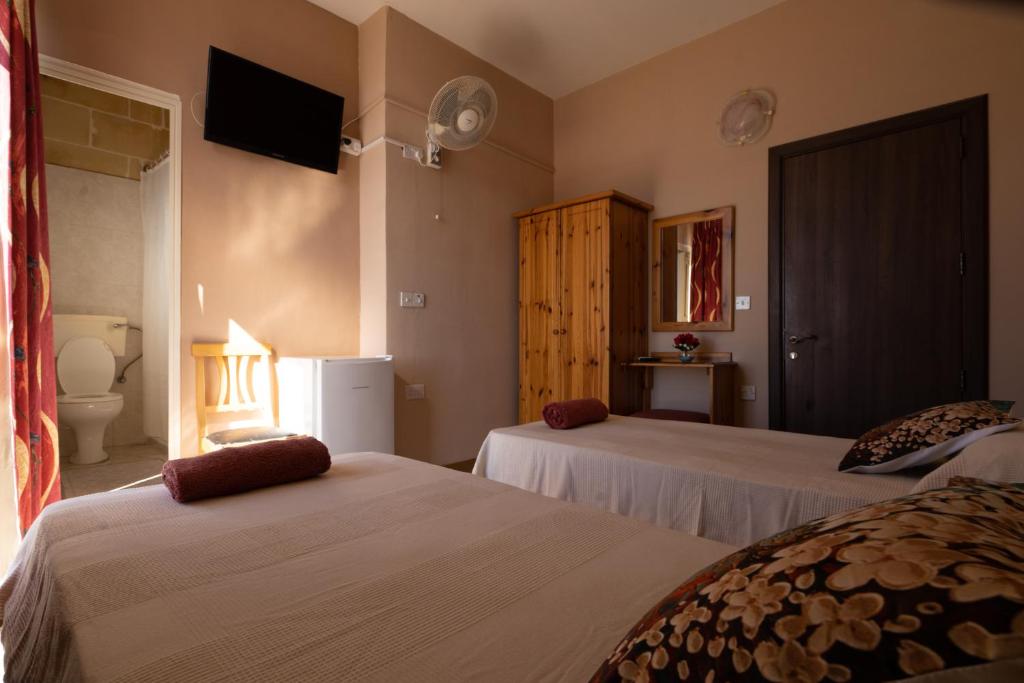 Voodi või voodid majutusasutuse Sunset Seaview Accommodation toas