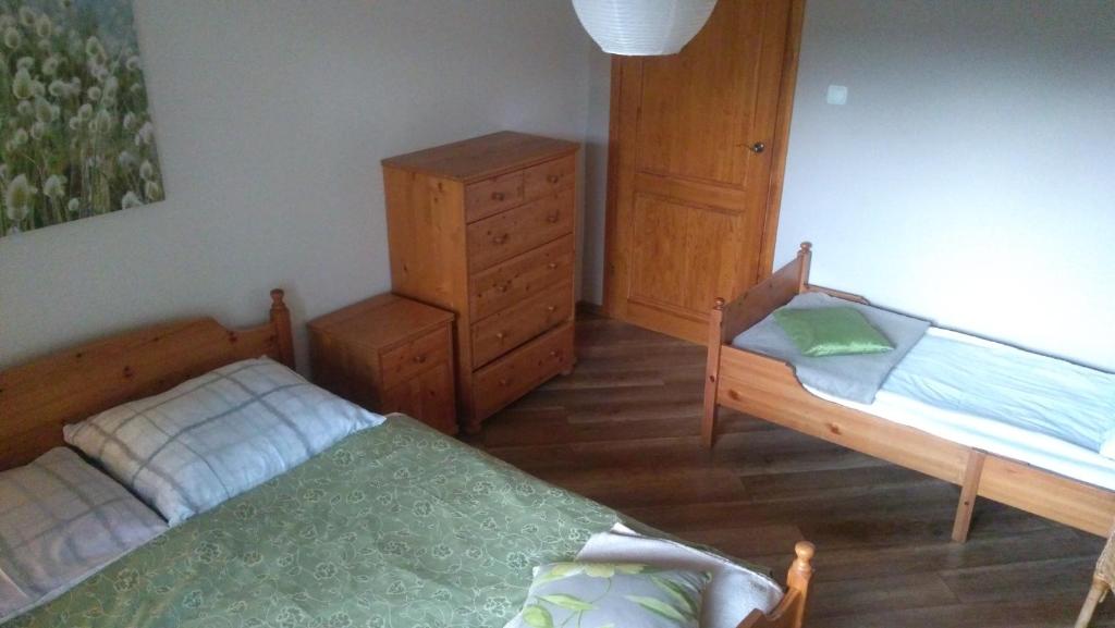 Posteľ alebo postele v izbe v ubytovaní Dom Gościnny "Pod Siódemką"