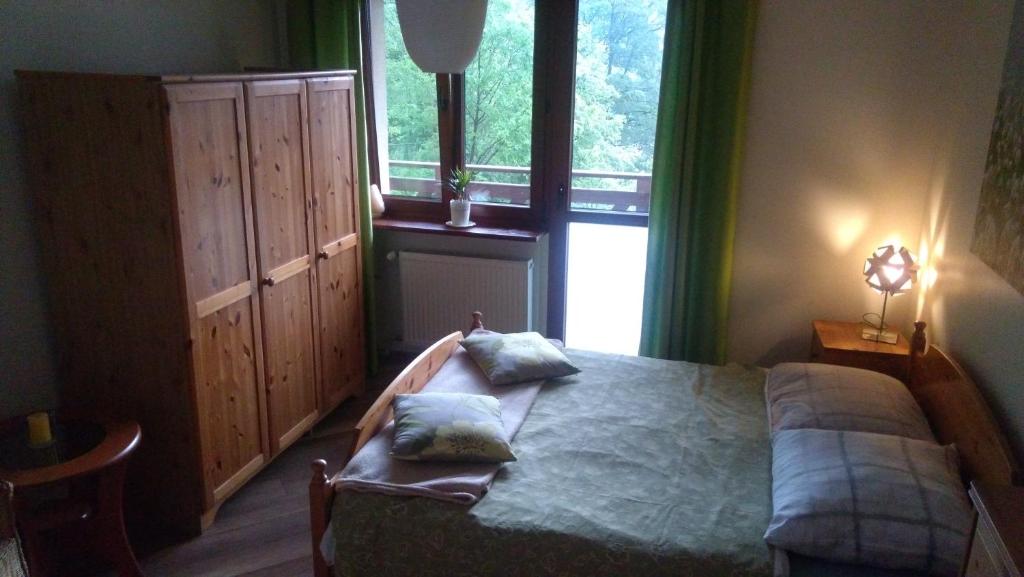 Posteľ alebo postele v izbe v ubytovaní Dom Gościnny "Pod Siódemką"