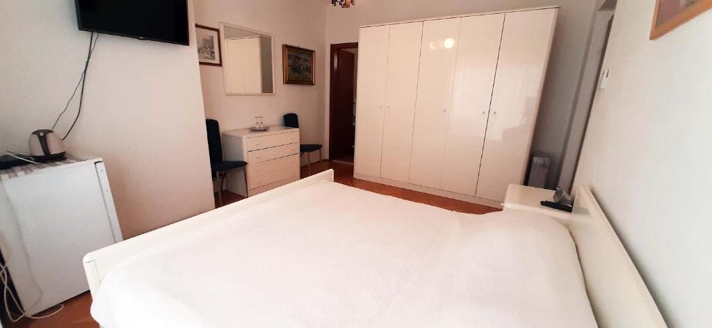 Postel nebo postele na pokoji v ubytování Rooms N&M