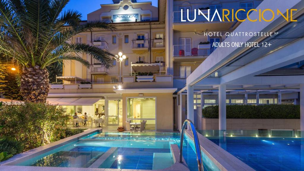 a view of a hotel with a swimming pool at Hotel Luna Riccione e Aqua Spa Only Adults +12 in Riccione