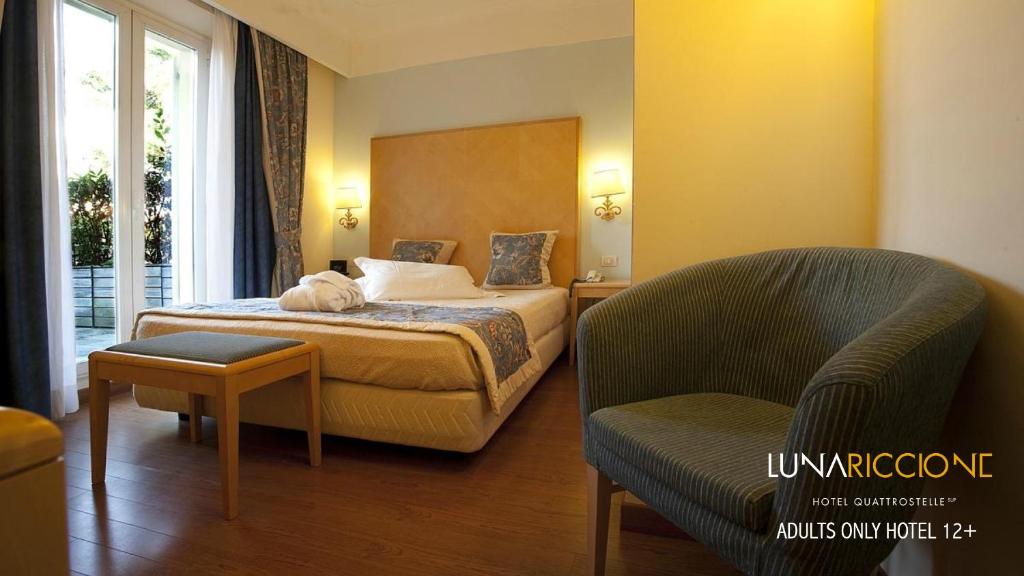 Postel nebo postele na pokoji v ubytování Hotel Luna Riccione e Aqua Spa Only Adults +12