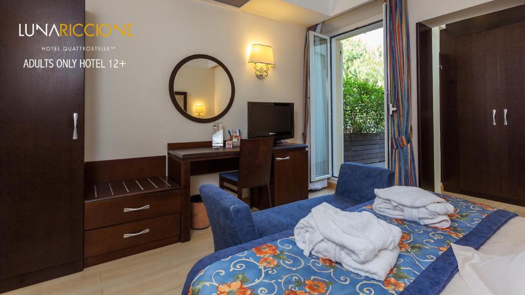 Postel nebo postele na pokoji v ubytování Hotel Luna Riccione e Aqua Spa Only Adults +12