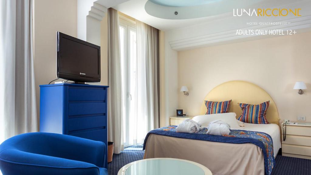Postel nebo postele na pokoji v ubytování Hotel Luna Riccione e Aqua Spa Only Adults +12