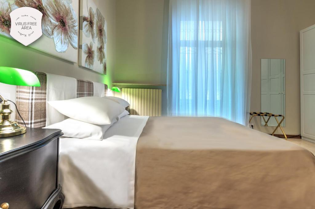 Cama o camas de una habitación en Ramé Suites