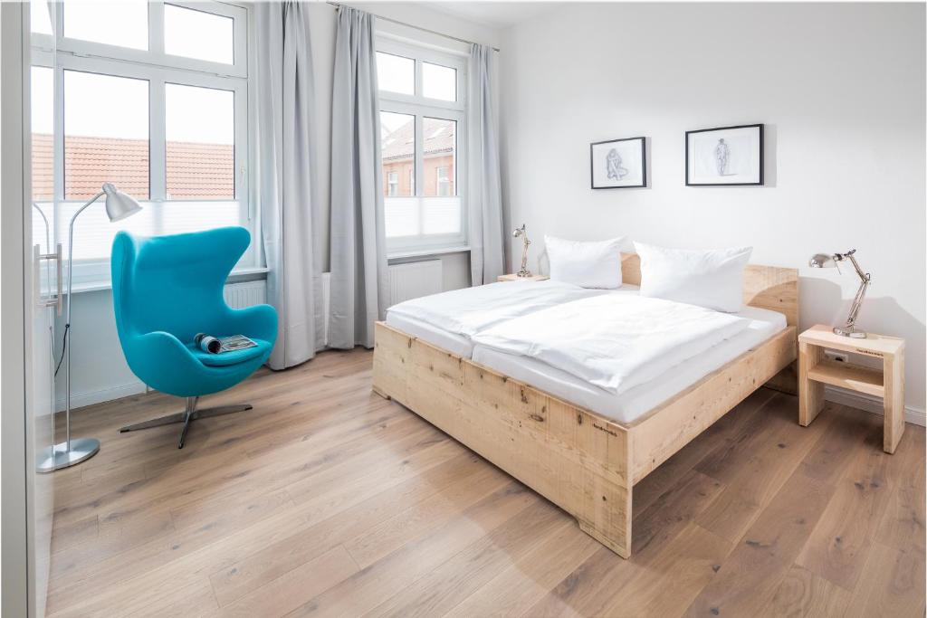 Postel nebo postele na pokoji v ubytování Strandloft Zwei Norderney