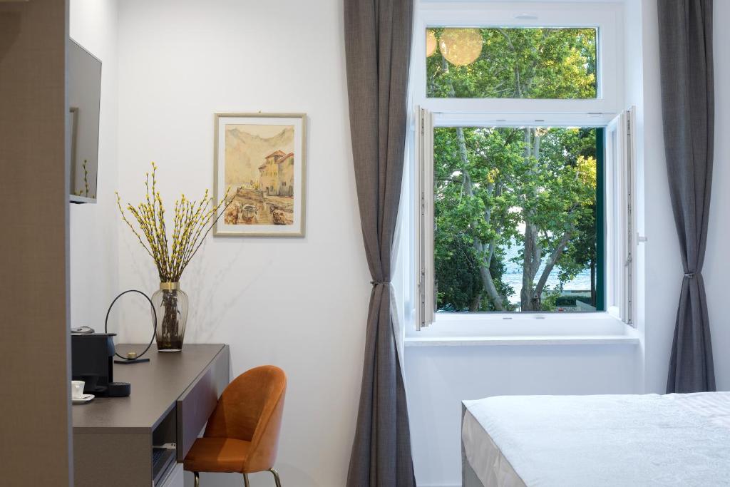 Postel nebo postele na pokoji v ubytování Green Park Luxury Rooms