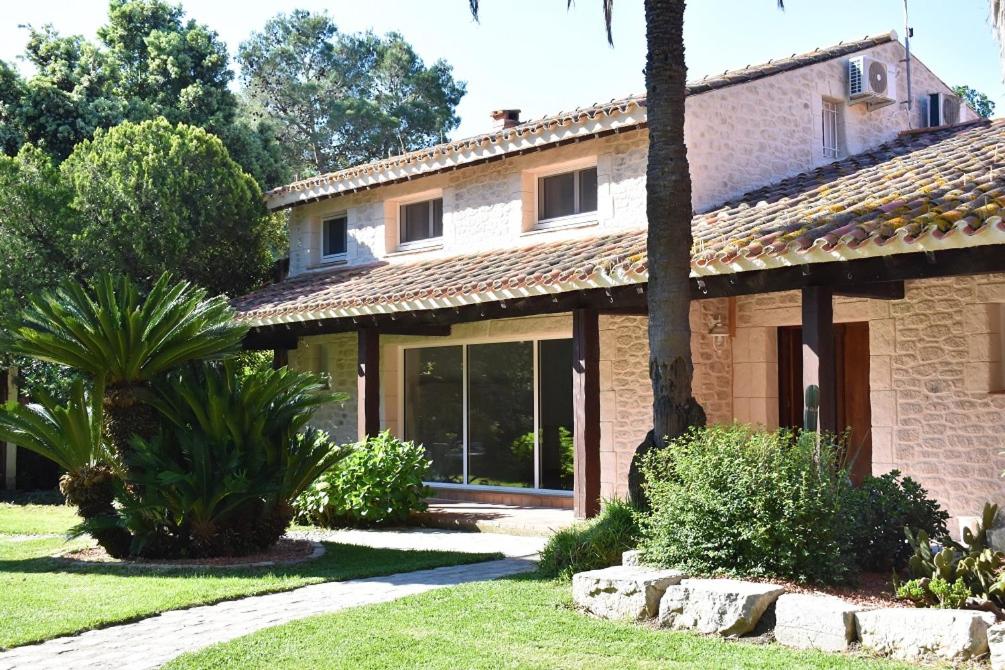a stone house with a garden in front of it at La Villa Saint André - Argeles sur mer in Argelès-sur-Mer