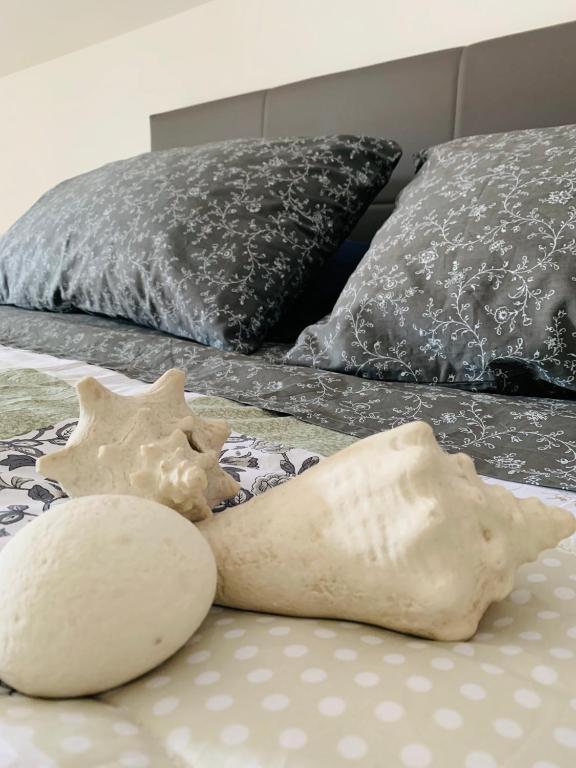 Postel nebo postele na pokoji v ubytování B&B SGUARDO AL CONERO