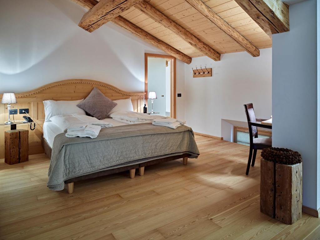 Postel nebo postele na pokoji v ubytování Romantic Hotel Excelsior