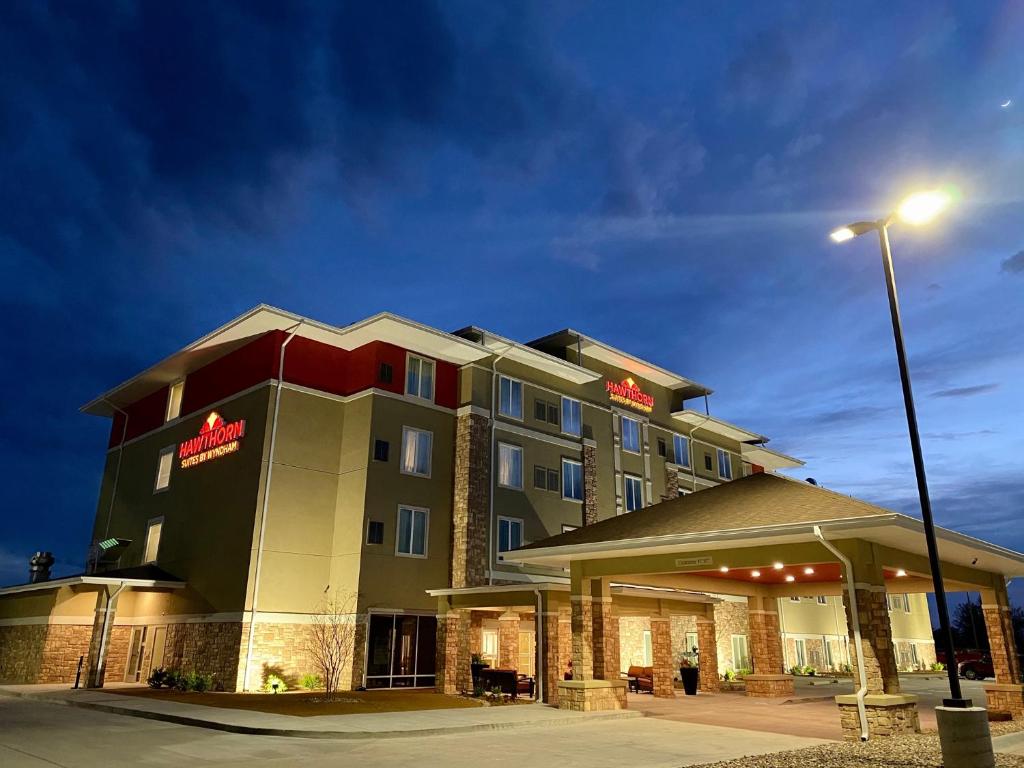 a hotel building with a light pole in front of it at Hawthorn Extended Stay by Wyndham Monahans in Monahans