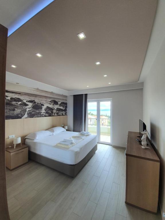 Postel nebo postele na pokoji v ubytování Apartments Hermes