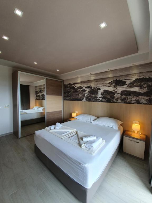 Postel nebo postele na pokoji v ubytování Apartments Hermes